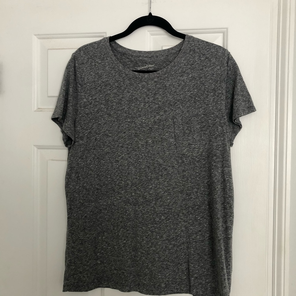 Size L tshirt with pocket fits like a medium
